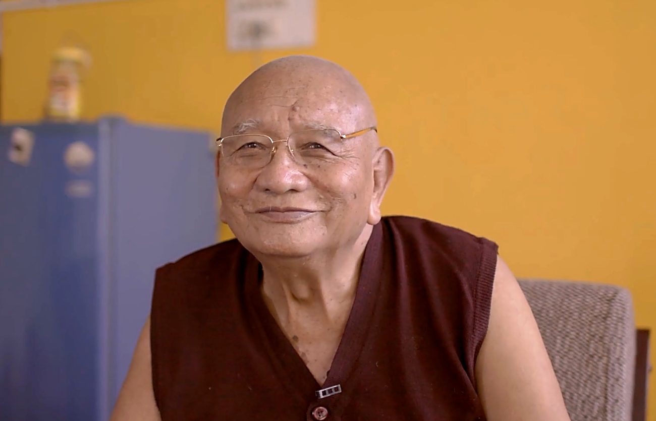 An elder teacher of the tradition, smiling