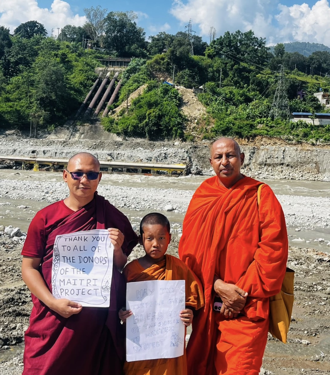Monastics sharing messages of gratitude by the river