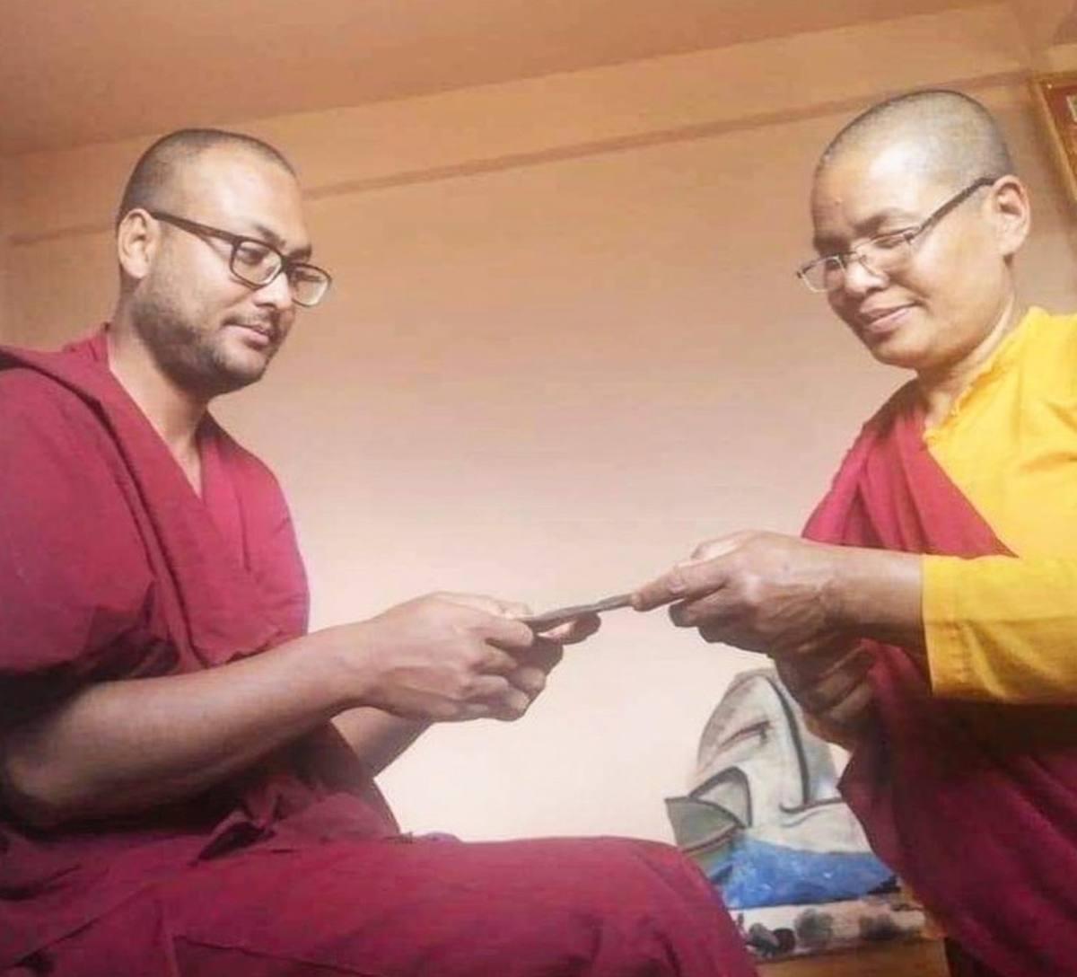 A Buddhist nun teaching with an expressive hand gesture