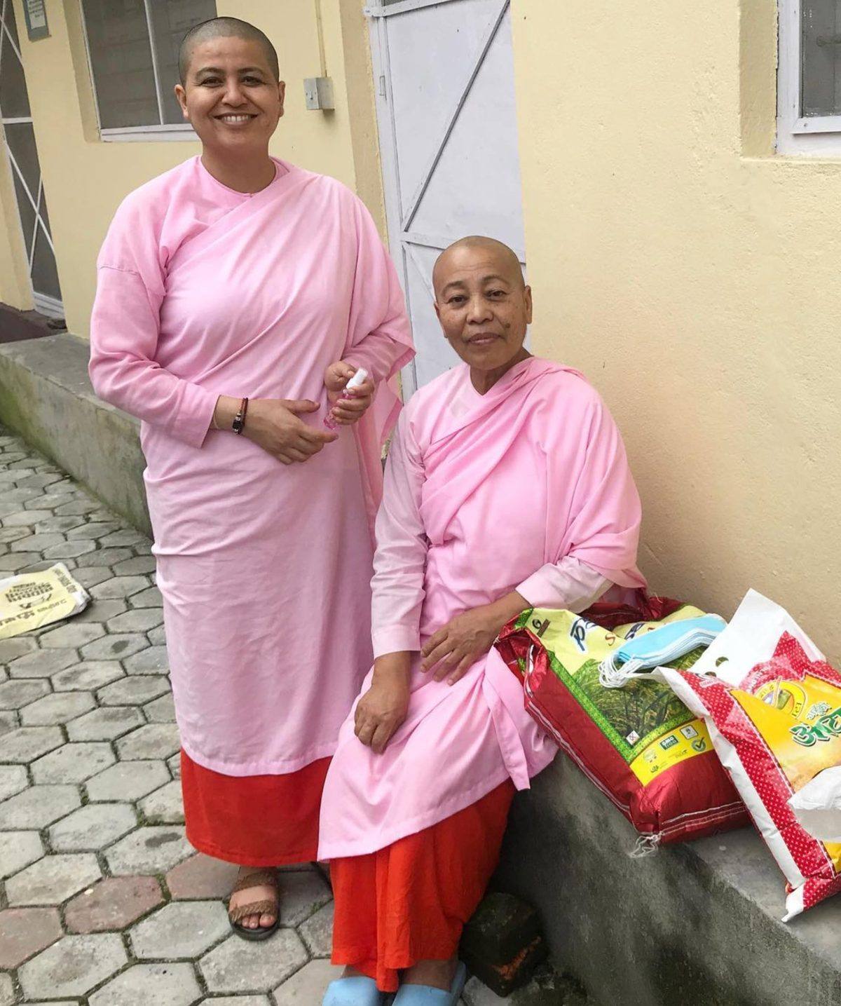 Buddhist nuns receiving supplies through Maitri-supported work